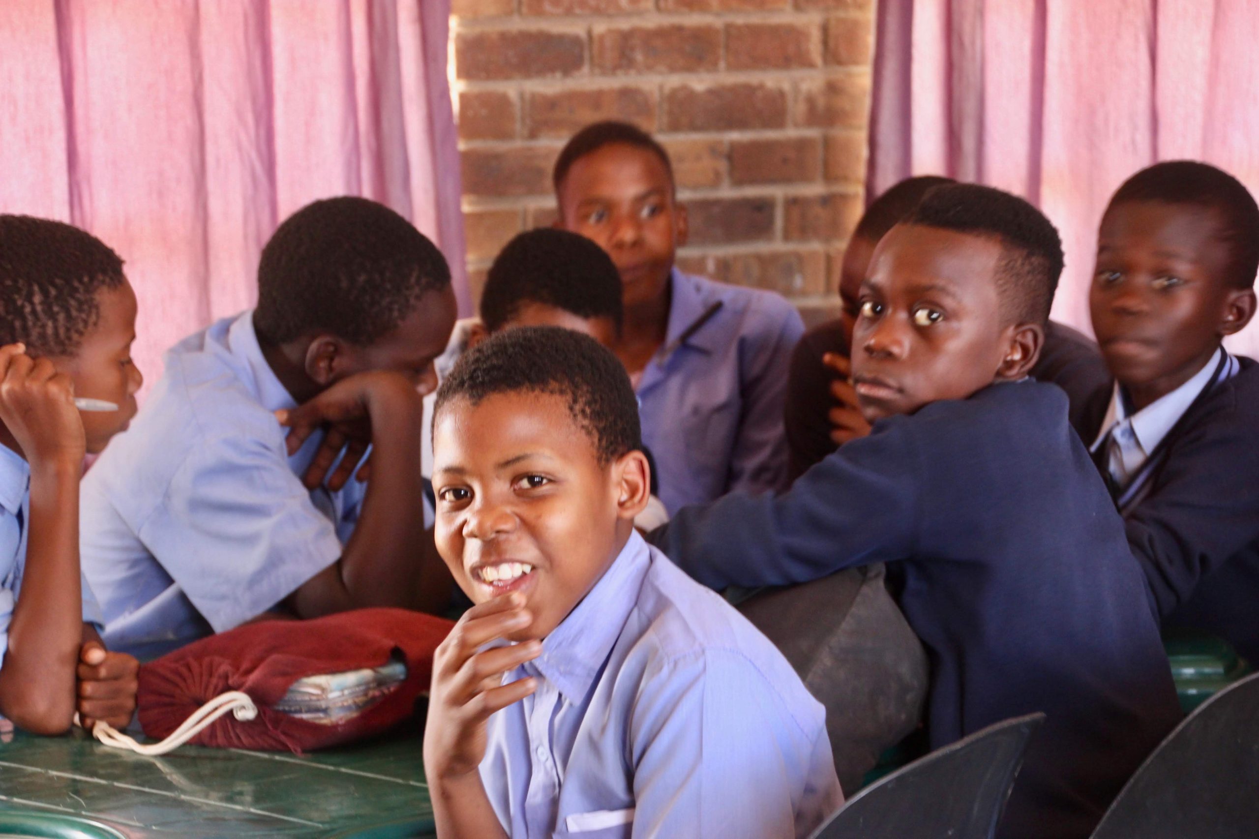 african children listening in a classroom